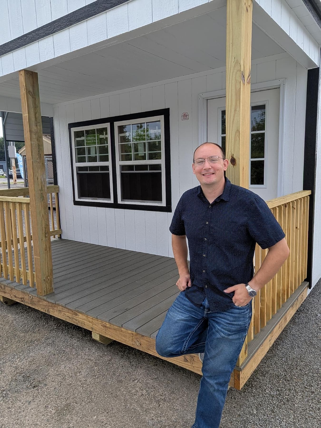 Steve on the porch of a cabin at the Crossroads lot in Cape Girardeau
