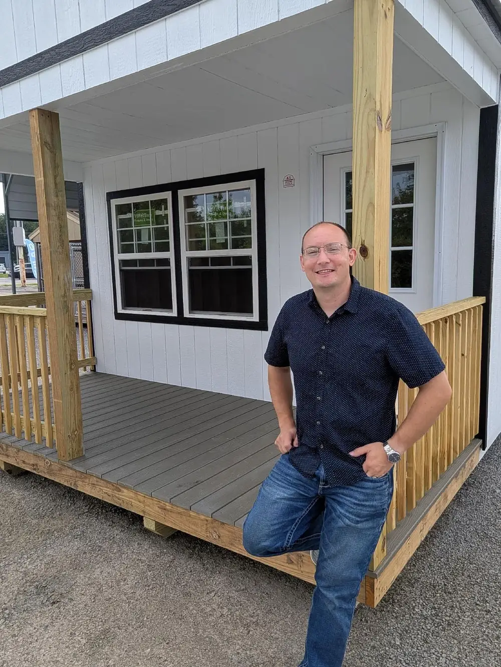 Steve on the porch of a cabin at the Crossroads lot in Cape Girardeau